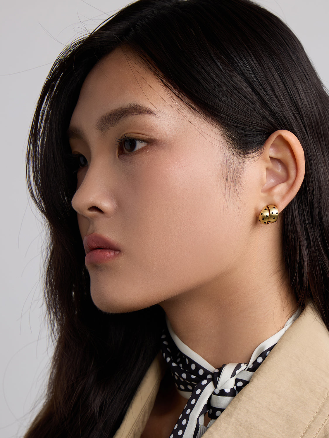 gold with black polka dot