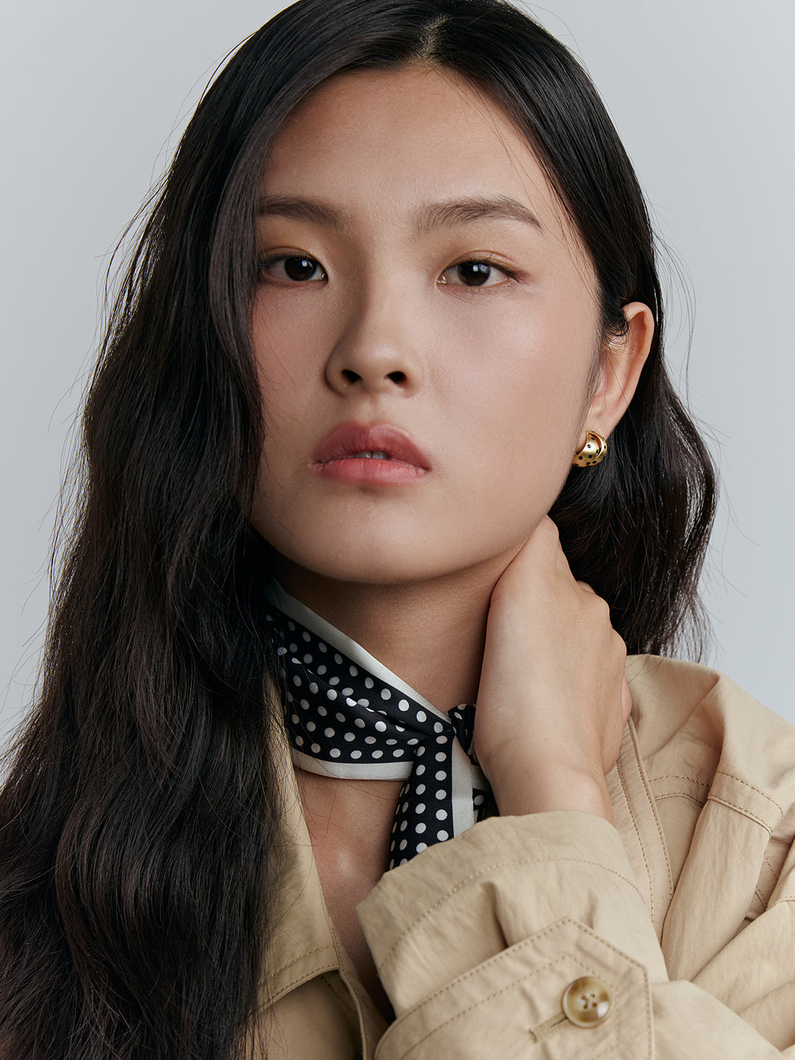 gold with black polka dot