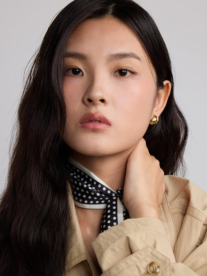 gold with black polka dot