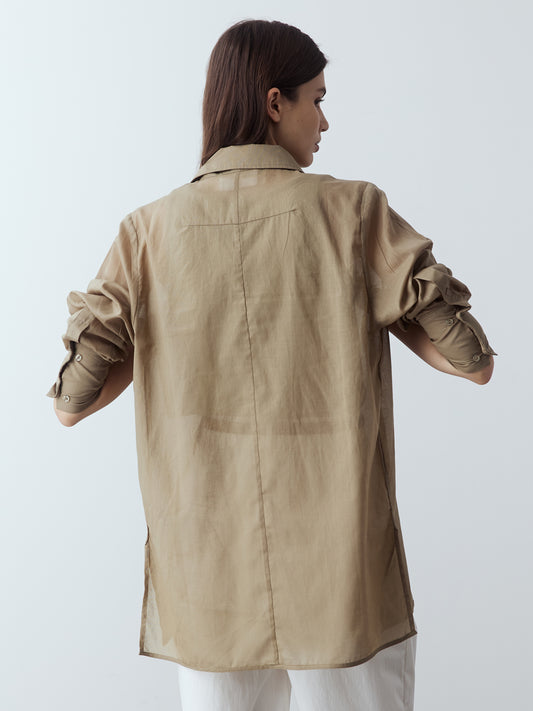 Model is wearing the Sheer Long Sleeve Shirt in Khaki, which comes with a straight hem, front placket with buttons and a left breast pocket. Worn with the Jersey Tank in Khaki, the Cotton Tailored Trousers in White and white strappy heels.